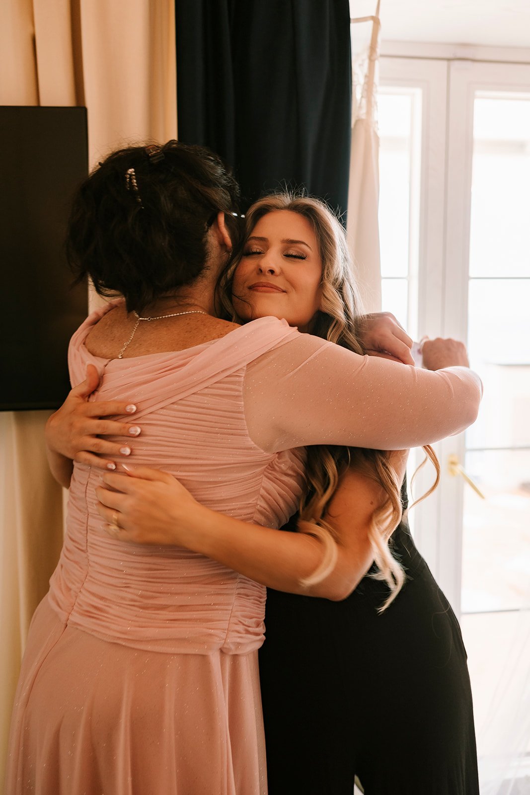hug bride and mother